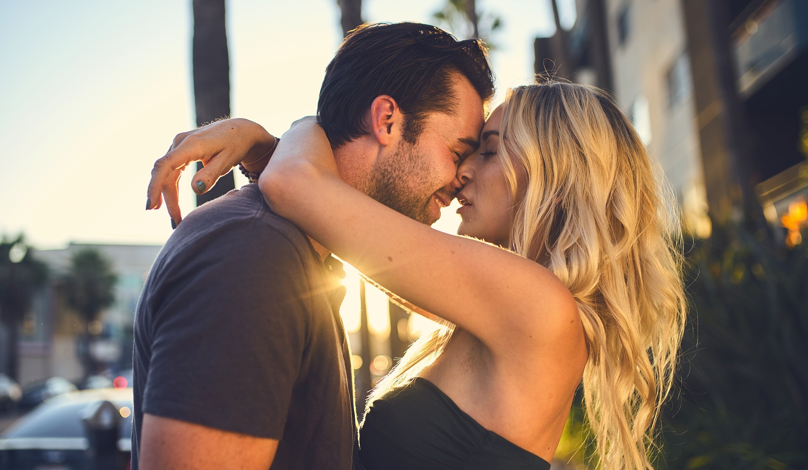 Couple sharing a joyful moment together in bed.